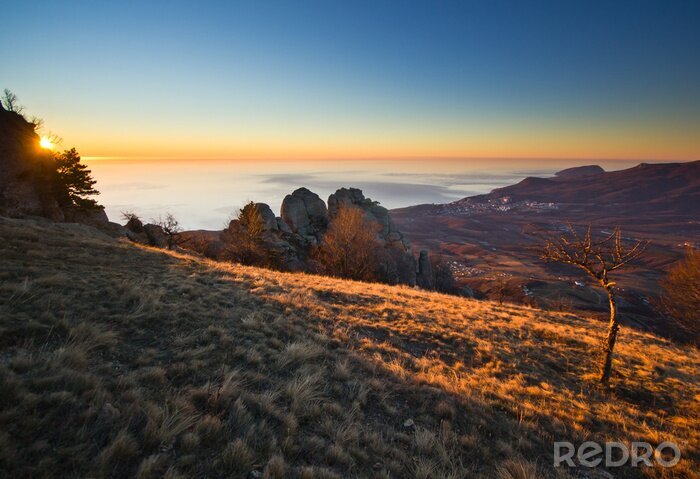 Fotobehang aerial view from mountains of magnificent sunrise above the sea