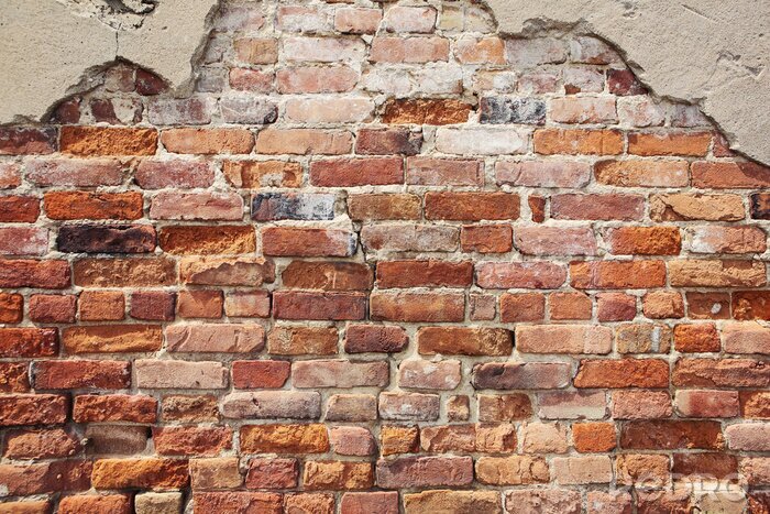 Fotobehang Afbrokkelende bakstenen muur