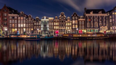 Fotobehang Amsterdam bij nacht in de zomer