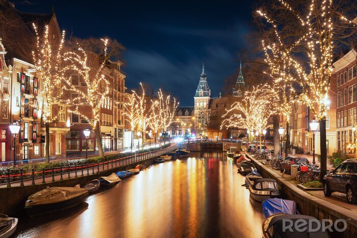 Fotobehang Amsterdam bij nacht met verlichting