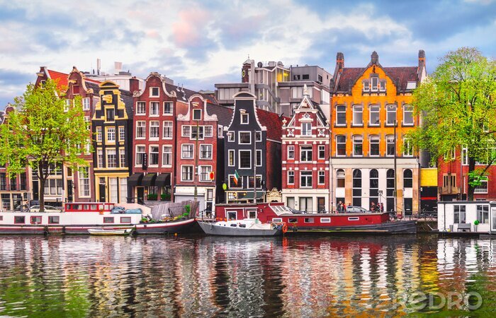 Fotobehang Amsterdam Nederland dansende huizen over het Amstel-landschapsrivier