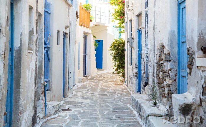 Fotobehang Architectuur op de Cycladen. Griekse eiland gebouwen met haar ty