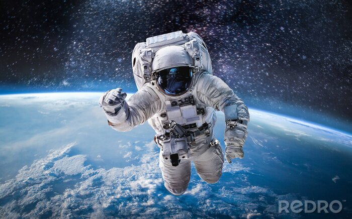 Fotobehang Astronaut boven de planeet Aarde