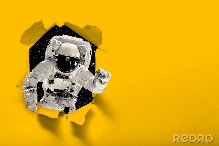 Fotobehang astronaut flies over the earth in space.