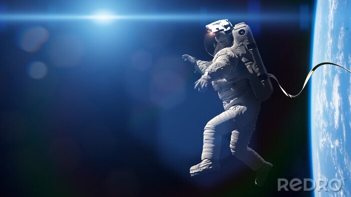 Fotobehang Astronaut in de ruimte tegen de achtergrond van de planeet