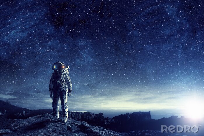 Fotobehang Astronaut in de ruimte tegen de sterren