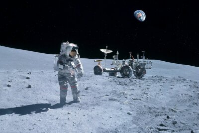 Fotobehang Astronaut met de aarde op de achtergrond