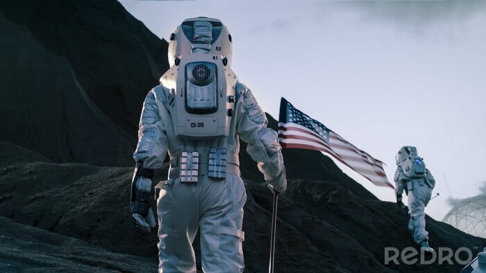 Fotobehang Astronaut met een Amerikaanse vlag