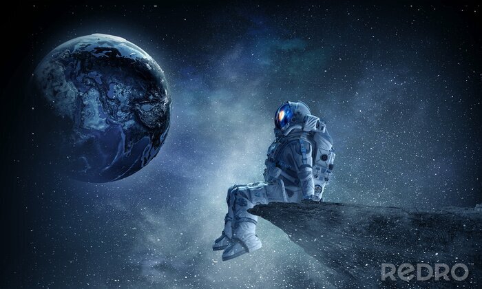 Fotobehang Astronaut op een rots