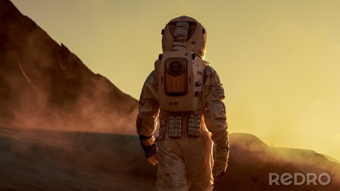 Fotobehang Astronaut op Mars tijdens zonsondergang