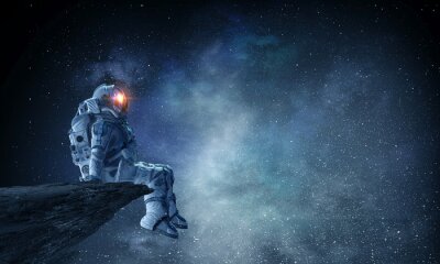 Fotobehang Astronaut zittend op een rots