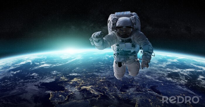 Fotobehang Astronaut zweeft door de ruimte