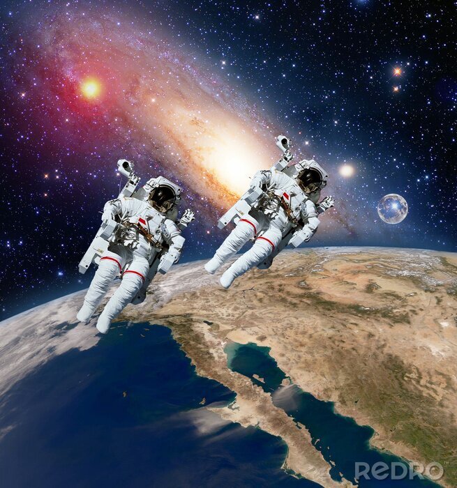 Fotobehang Astronauten tegen de achtergrond van de planeten
