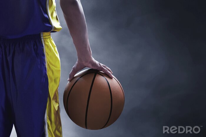 Fotobehang Basketbal in de hand van de speler