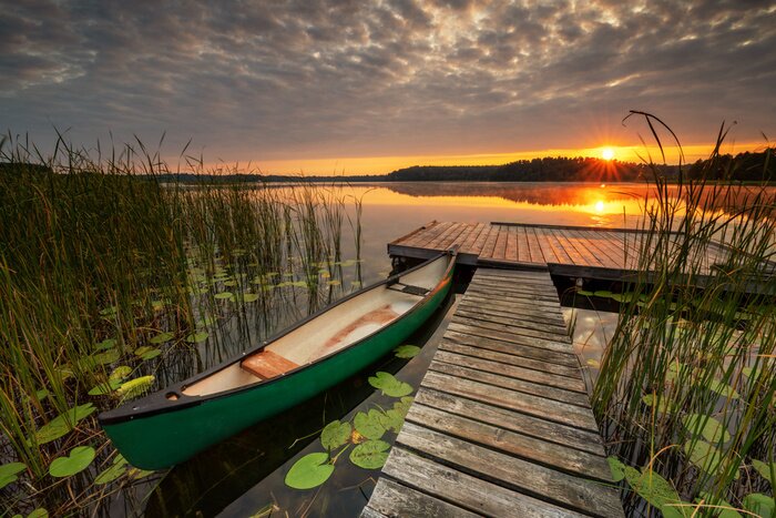 Fotobehang Beautiful summer sunrise over lake