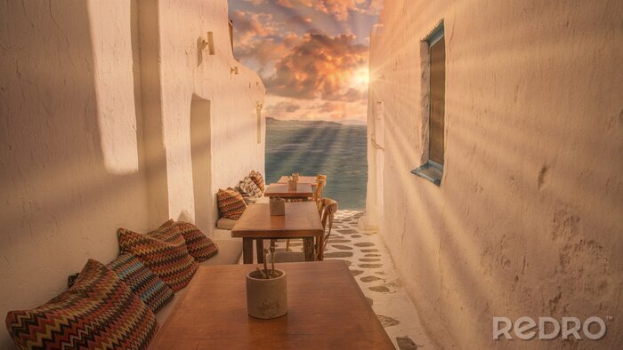 Fotobehang Benches with pillows in a typical Greek bar in Mykonos town with sea view, Cyclades islands, Greece. Travel concept.
