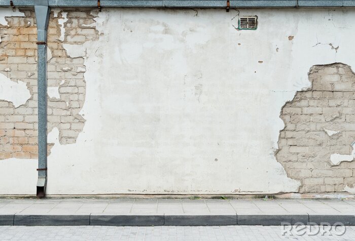 Fotobehang Betonnen muur in de straat