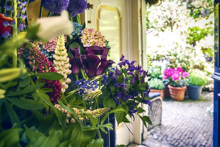 Fotobehang bloemen winkel met tuin
