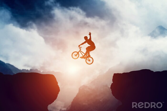 Fotobehang BMX-fiets en sprongen over rotsen