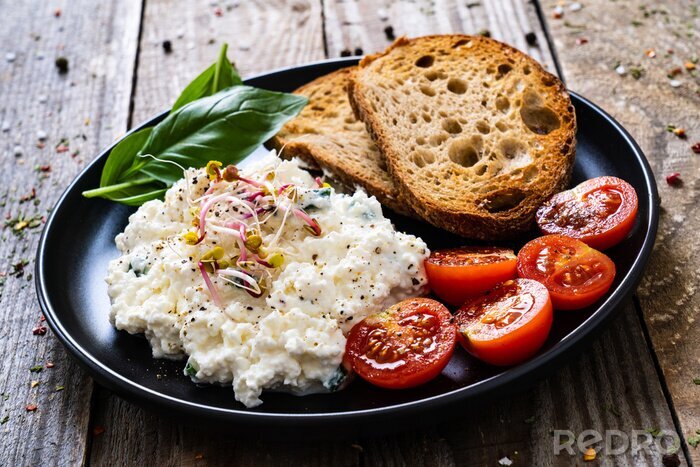 Fotobehang Breakfast - cottage cheese, toasts and vegetables

