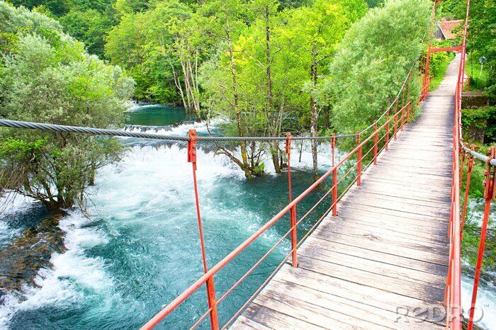 Fotobehang Brug over een stromende rivier