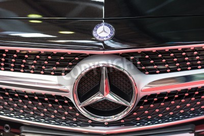 Fotobehang BUCHAREST, ROMANIA - OCTOBER 31, 2014: Mercedes Benz Sign Close Up. Founded in 1926 is a German luxury automobile manufacturer, a multinational division of the German manufacturer Daimler AG.