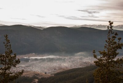 Fotobehang Bulgarian town - Sarnica. Rhodope mountains. Fog , Clouds , Sunset.
