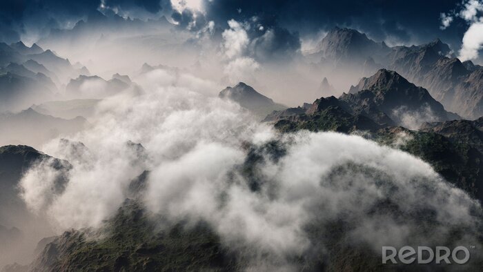 Fotobehang Clouds over mountain range. Aerial view.