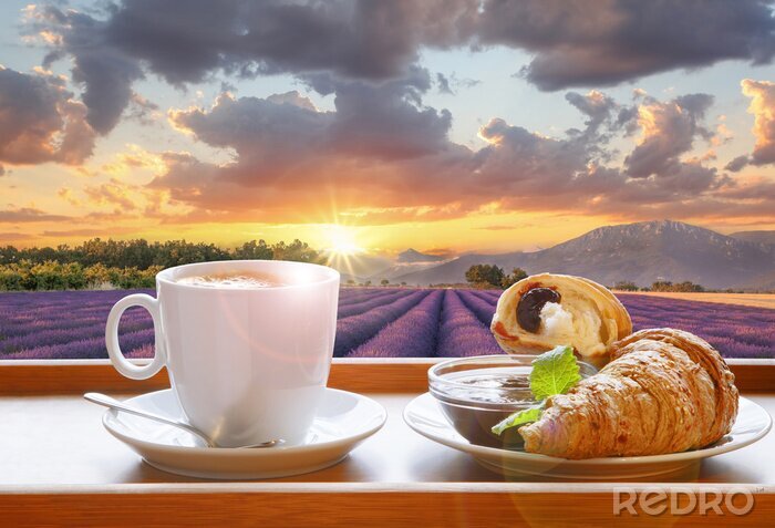 Fotobehang Coffee with croissants against lavender field during colorful sunset in Provence, France