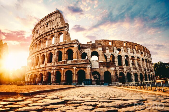 Fotobehang Colosseum op de achtergrond van de zonsondergang
