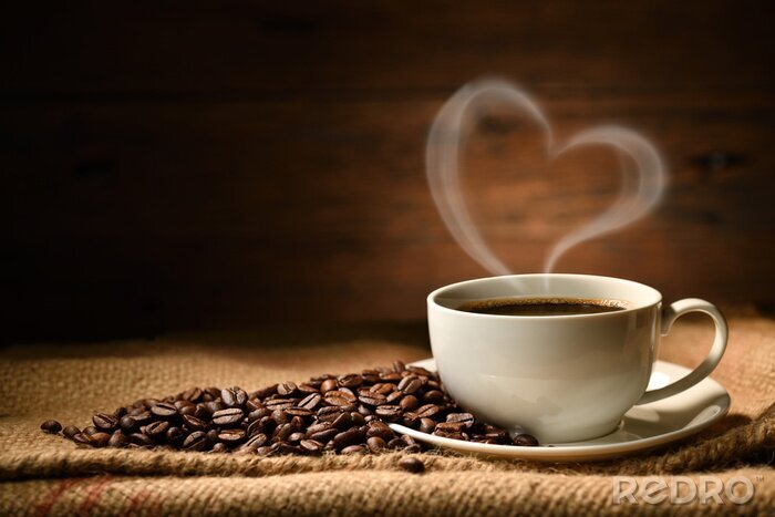 Fotobehang Cup of coffee with heart shape smoke and coffee beans on burlap sack on old wooden background