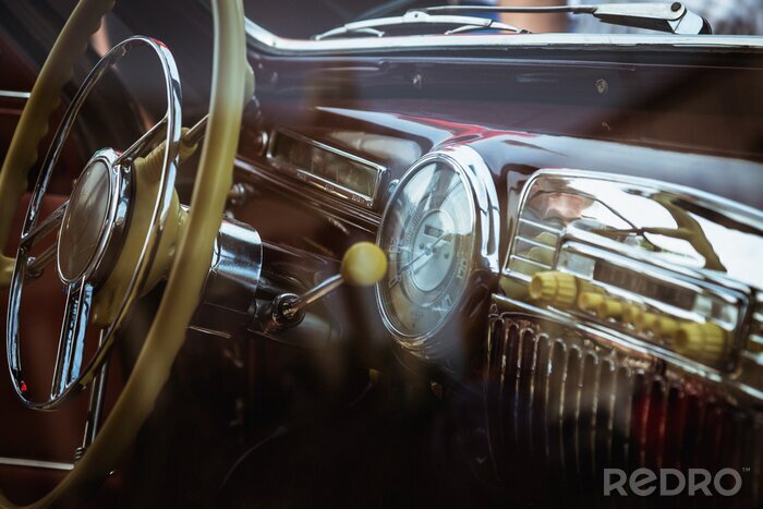 Fotobehang Dashboard and steering wheel in retro car interior