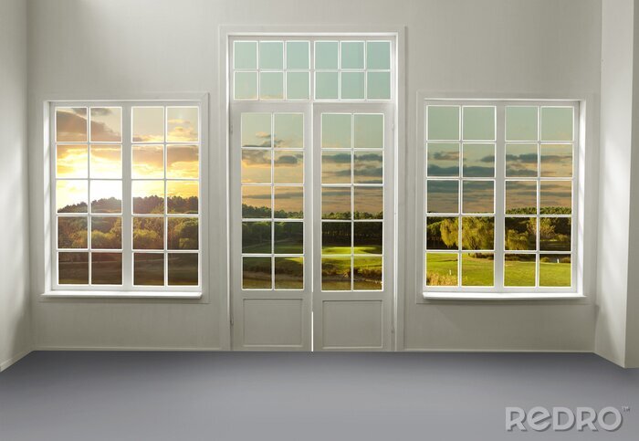 Fotobehang De ramen van het huis kijken uit op de weide