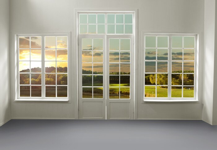 Fotobehang De ramen van het huis kijken uit op de weide