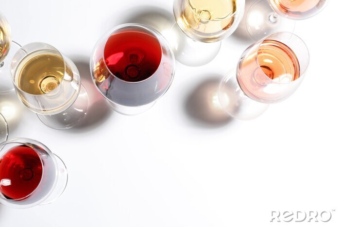 Fotobehang Different glasses with wine on white background, top view