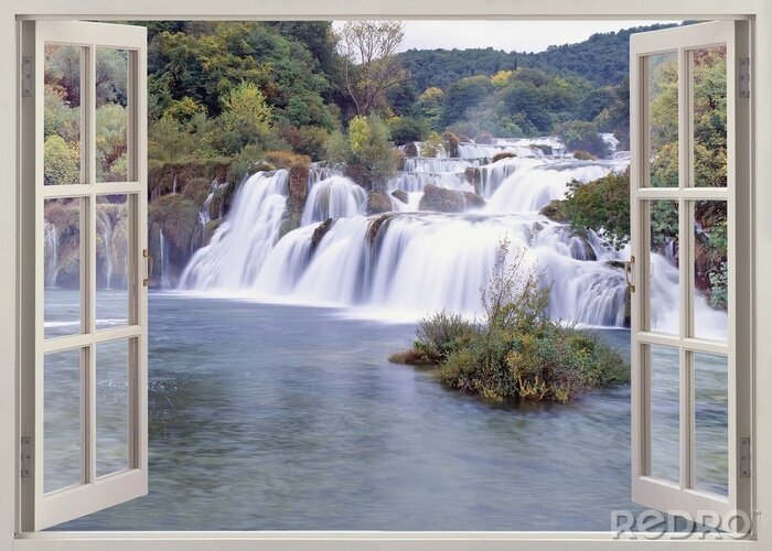 Fotobehang Een raam met uitzicht op een grote waterval