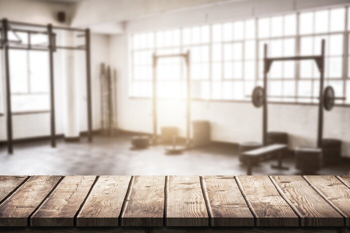 Fotobehang Een stijlvolle sportschool met gewichten in vintage-stijl