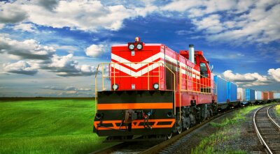 Fotobehang Een trein met een weide op de achtergrond