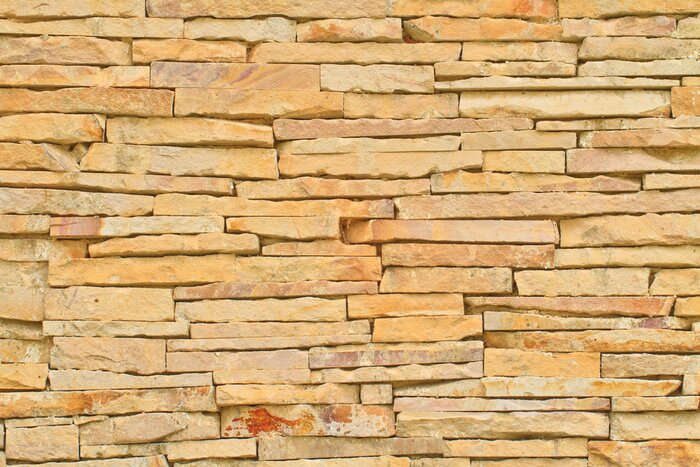 Fotobehang Gele leistenen muur