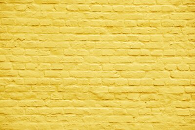 Fotobehang Gele stenen muur