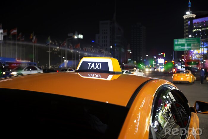 Fotobehang Gele taxi bij nacht