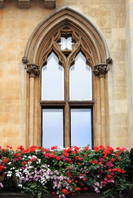 Fotobehang Gothic window with decorations and flowers