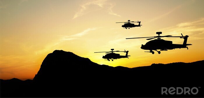 Fotobehang Helikopter silhouetten op zonsondergang achtergrond
