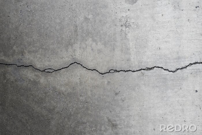 Fotobehang Horizontale scheur langs betonnen muur