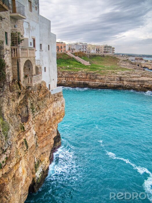 Fotobehang Huis op een klif aan zee