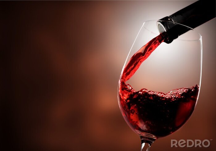 Fotobehang Ingeschonken rode wijn in een glas