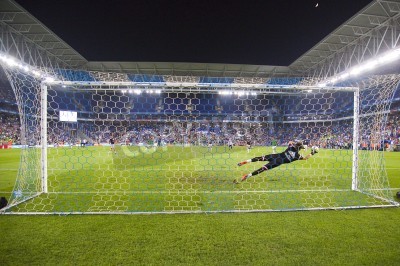 Fotobehang Keeper vangt de bal