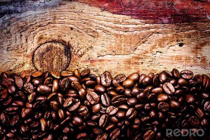 Fotobehang Koffie gestrooid op hout