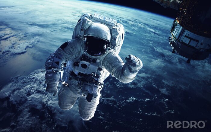 Fotobehang Kosmische ruimte 3d astronaut op de achtergrond van de planeet