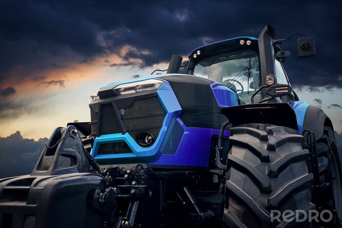 Fotobehang Krachtige tractor tegen een stormachtige hemel